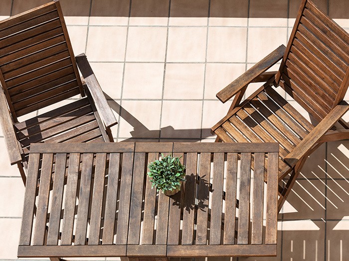 Small wooden foldable chairs and coffee table.